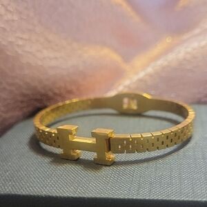 Gold Tone Bracelet with H Design
